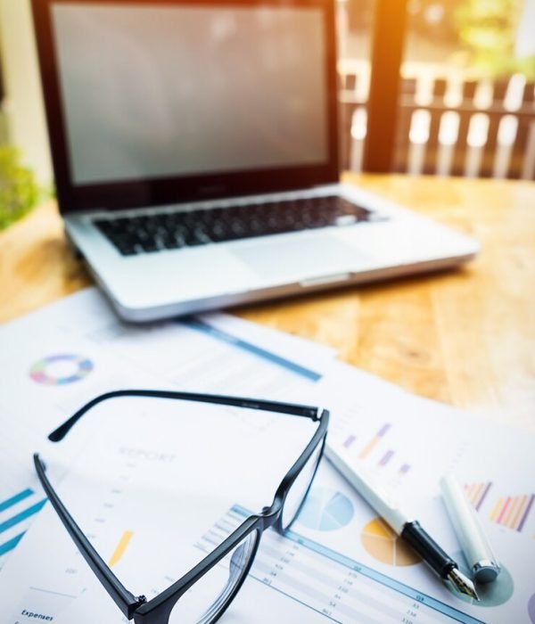 office-workplace-with-laptop-glasses-wood-table_1423-52